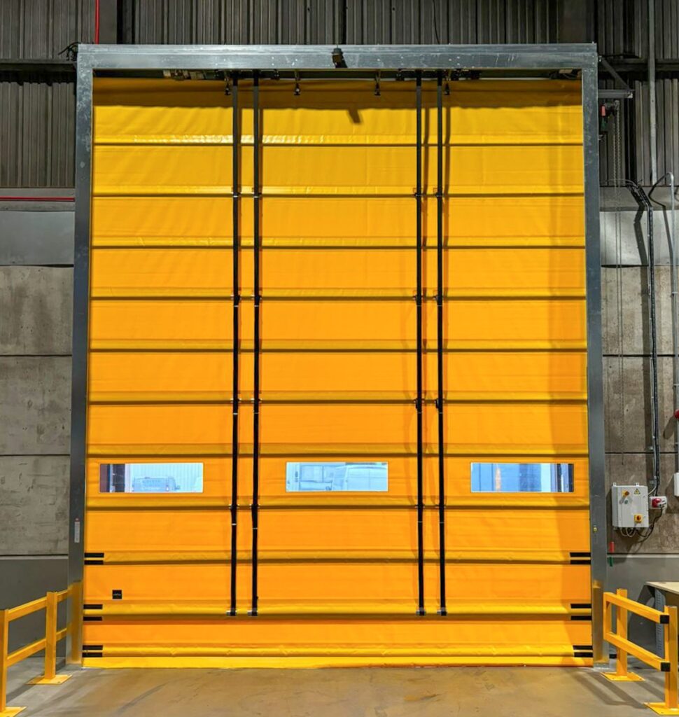Large yellow industrial folding door